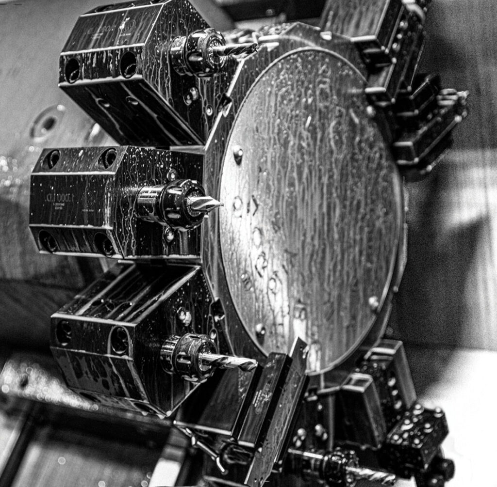 A black and white photo of a precision manufacturing company's machine.
